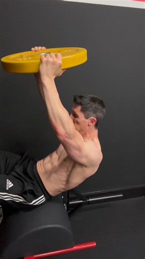 A little twist on traditional crunches. Don’t be afraid to add weight to your ab work. They’re muscles just like any other and they respond to overload in a form other than just always more volume and more reps! #core #sixpack #abexercises #weightedabsworkout #abs #train #athleanx | ATHLEAN-X™ | Jeff Cavaliere MSPT, CSCS