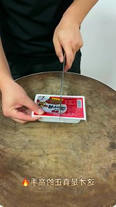 Careful with those scissors! ✂️🧧 Making sure every detail is perfect. #CraftingFun #AttentionToDetail | Annie Branton