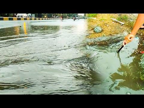 Unclogging Culvert Drain After Heavy Rain On The Road