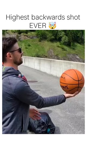the error on Instagram: "The nistagram reel shares a 2015 viral video by Australian trick-shot group How Ridiculous, depicting a backwards basketball throw from a 170m-high bridge in the Swiss Alps that arcs over a valley to swish a hoop on a distant field. Despite scepticism in replies labelling it 'fake' or AI-generated, the shot is genuine, captured on the third attempt after days of practice, with the edit focusing solely on the success. It claims the 'highest backwards shot ever', referring