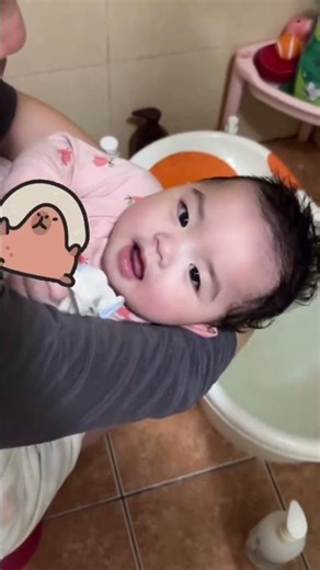 See how a small child’s head is washed.”