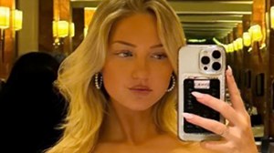 Glam boxing ring girl Sydney Thomas risks wardrobe malfunction at glitzy ball