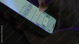 Text message with mobile phone. Woman texting sms with smartphone. Catfish or digital scam. Screen keyboard in instant messaging chat. Macro shot of finger writing.