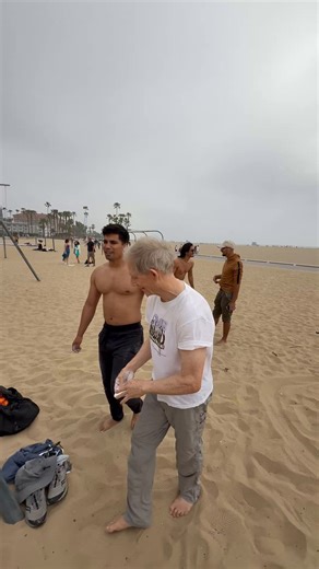 This man’s name is Kim. He is 77 years old. These guys on the beach were challenging people to see who could climb the rope to the top. 77 years old or in his case, young, and making it look as easy as if he was in still in college. I would surmise that he is in the top .01% of his age bracket. I hope to be half as agile as he is at that age. Phenomenal shape. Do you think you’ll be able to climb that when you’re his age?