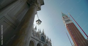 Campanile of St. Mark's Cathedral in Venice Venice Italy. A beautiful tower with a clock in the center of a touristic, historical and romantic city. High quality 4k footage