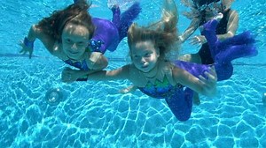 Two Happy Little Girls Swim Pose Stock Footage Video (100% Royalty-free) 1068210572 | Shutterstock