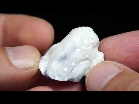 Analcime, ps after Sodalite, Poudrette quarry, Mont Saint-Hilaire, Québec, Canada