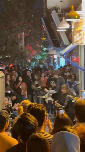 Afshin Ismaeli on Instagram‎: "Moments like this were unthinkable just a few years ago. In a recent viral video from Tehran, @arshia_singer rock band performs “seven nation army” by jack white in public as men and women gather, dancing and cheering freely. Since the Mahsa Jina Amini protests, the regime has struggled to fully reimpose strict hijab rules or curb public displays like this. The government has become more cautious in recent months, especially after Israel’s attacks, fearing that har