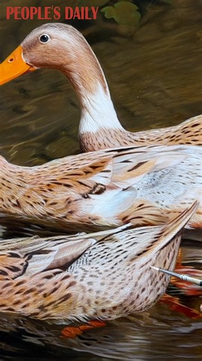 A vivid scene of ducks paddling on the water comes alive under the tender brushstrokes of this talented Chinese artist. | People's Daily, China