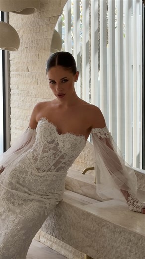 Lé Lee Studio Bridal on Instagram: "Meet Theadora, a stunning fully beaded lace wedding dress from our new FW26 collection, coming soon to international retailers 🤍 Content creator @themodernbridesbff Photography @saltatelier_wedding MUA @stinimakeupandhair Hair @marinamedicimakeup #laceweddingdress #fittedweddingdress #basquewaistweddingdress #longsleeveweddingdress #corsetweddingdress"