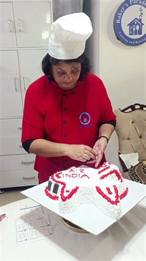 Adding finishing touches to our Aeroplane Cake #bakersparadisepg #professional #cake
