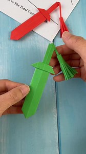 8.9K views · 78 reactions | ️ Title: Let’s Make an Origami Sword with Handle Tassels!  Hashtags: #OrigamiSword #PaperSwordCraft #DIYOrigamiWeapon #SwordWithTassels #PaperTasselCraft #CreativeOrigami #KidsSwordDIY #FoldedFun #OrigamiToy #EasyPaperCraft | paper craft ideas | Facebook