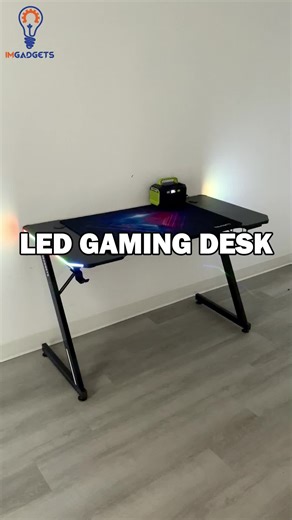 Level Up Your Gaming Setup! Take your gaming experience to new heights with the IMGadgets LED Z-Shaped Gaming Desk! 🎮 Designed for gamers, this desk combines style, comfort, and functionality to give you the ultimate setup. With its spacious surface, vibrant LED lighting, and gamer-friendly features, it’s built to keep you in the zone! Features: 🌟47