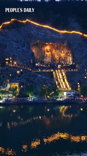 8.7K views · 160 reactions | Find serenity at night in Luoyang, C China's Henan Province, where the Buddha statue at the Longmen Grottoes illuminates with radiant golden lights, offering an escape from the hustle and bustle. | People's Daily, China | Facebook