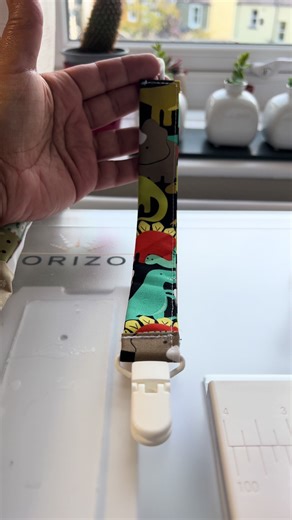 DIY Dino 🦕 Pacifier Clip! ✨ 4”x10” fabric ✨ 6” elastic (1/8”) ✨ 1” pacifier clip \t•\tsewing machine & bright thread so you can see every stitch! 🧵💥 #SewingTok #DIYPacifierClip #BabyDIY #CraftTok #MomsWhoMake #SewingProject #HandmadeWithLove
