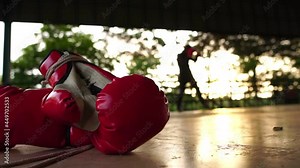 Footage Slow Motion: Boxing gloves and boxing athletes practicing