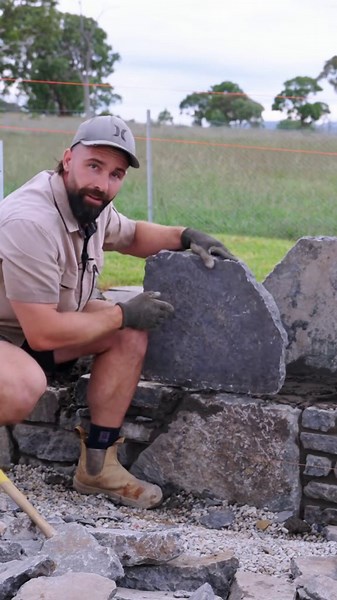 The slow process of learning stone placement. One day I’ll learn. #stonemason #construction #landscaping #stonework #building