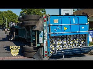 Overloaded container rollover recovery in busy intersection