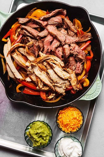 Bring some fiesta to your kitchen with this one skillet, Keto Chicken and Beef Fajitas! Traditional fajita spices with savory chicken, tender beef and perfectly sautéed peppers and onions..all in one skillet and in just 30 minutes! ✅Recipe:https://jenniferbanz.com/keto-fajitas | Low Carb Recipes with Jennifer