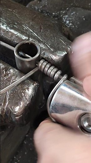 Spiral handle. Spring handle. Winding the wire spring. Wood stove handle spring