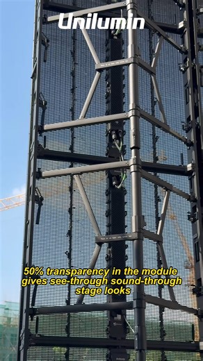 Watch this 20-meter-high TRANSPARENT LED hanging in the air with mind-blowing visuals. This is an order from one of our customers. They chose UpadIV ME transparent rental screen — boasting 50% transparency to deliver see-through and sound-permeable stage effects, perfect for jaw-dropping concerts, events & immersive experiences! 🎤✨ #LED #leddisplay #Unilumin #rental #LEDstage #transparentdisplay #liveevent | Unilumin