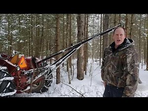 Logging with a tractor- Deep snow doesn't matter.