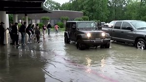 Heavy rain near Houston causes flooding, strands students at schools