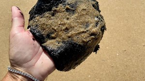 California oil spill: Lumps of oil wash ashore on Newport Beach