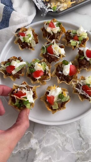 🌮 Taco Bites 🌮 These taco bites are simple to make and fun to eat. Bite sized tortilla chips filled with a seasoned ground beef mixture and topped with melted cheese and taco toppings. GET THE RECIPE: - Comment “RECIPE” and the link to the recipe will be sent to your DM’s. - OR tap the link in my bio Follow me @foodlovinfamily to be sure you are getting my DM’s 💟 https://www.foodlovinfamily.com/taco-bites/ #tacobites #minitacobites #scoops #taconight #tacotuesday #gamedayfood #gamedayrecipes 