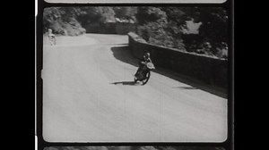 1947 Douglas, Isle of Man. Man Wrecks Motorcycle on Snaefell Mountain course during Isle of Man TT or Tourist Trophy Race. 4K Overscan of Vintage Archival Film Print
