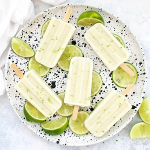 Lime in the Coconut Popsicles - These creamy coconut lime popsicles are such a tasty paleo or vegan treat! Just 3 ingredients and naturally sweetened, these are creamy, dreamy & delicious. Yum! RECIPE & MY FAVORITE POPSICLE MOLD HERE: https://www.onelovelylife.com/lime-in-the-coconut-popsicles/ | One Lovely Life