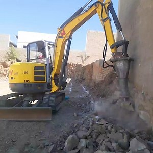 Built to perform. Built to last. The EZ53 may be from our previous range, but it’s far from retired. Our dealer partner in Namibia, Industrial Building Supplies and Plant Hire, puts it to work with a hydraulic breaker attachment — proving that Wacker Neuson excavators are your trusted long-term partner. | Wacker Neuson