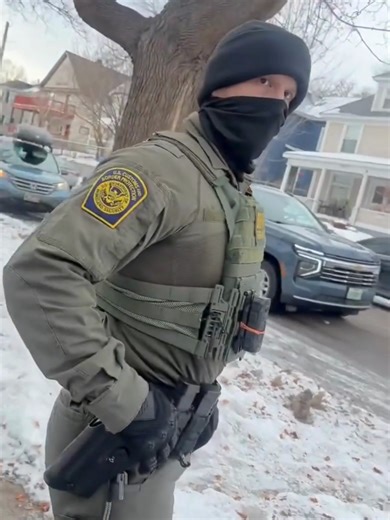 Minneapolis resident Nimco Omar said she was on a walk when she was approached by the masked agents. This footage shows one of the men repeatedly asking Omar for her place of birth and eventually relenting when she refused to show identification. “I parked my car and began walking toward the 24 Somali Mall where suddenly four men who looked like soldiers suddenly jumped out of a car and surrounded me,” Omar said in a post to Instagram. “They told me they needed to verify whether I was a citizen.