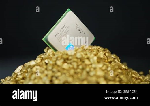 AMD CPU Central Processing Unit of the computer in the pile of gold. Concept of AI boom triggered shortage of CPUs, components for data centers: Toronto, Ontario, Canada - March 24, 2026 Stock Video Footage - Alamy