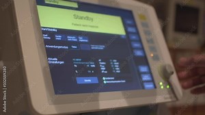 Nurse setting the pulmonary ventilator, medical machine used for patients with respiratory failure