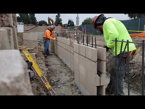 Laying block at work, stack bond, vertical rebar every 8 inches