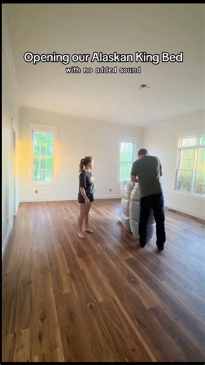 This couple just unboxed their very first Alaskan King bed and it is next-level massive! Many people have never even heard of this size before. Most know California Kings, but an Alaskan King takes things to a whole new level.For reference, a standard king mattress measures 76 inches wide by 80 inches long. An Alaskan King, however, measures a full 108 inches by 108 inches — that’s 9 feet by 9 feet!This leaves the question… is the Alaskan King becoming a new trend, or have these giant beds been 