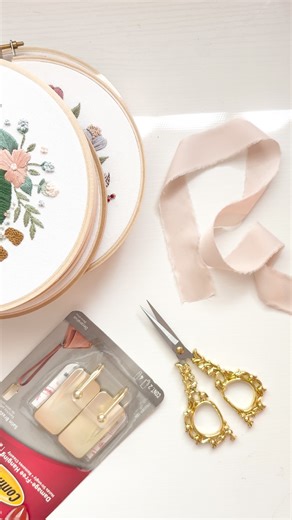 Embroidery by Emily June on Instagram: "An extremely easy hoop display idea that is super cute and quick to do! 1. Grab how many embroidery hoops you want to display, some scissors, and ribbon (you do not want stiff ribbon here. I used 1 inch satin from @michaelsstores in a beige blush color!) 2. Bring your ribbon forward through the hoop you want to be lowest on the display, and tie a secure bow. You can tie a knot first if you want, but I found I didn’t need to! 3. A few inches down the line o
