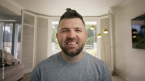 Uncertain Confused male scratching beard on web camera. Mature handsome businessman find great idea on online video.Hesitant job applicant on video call interview 4K. Smiling 40s guy talking to camera