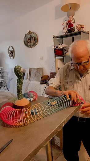 Elderly Man Crafts Unique Cactus-Shaped Object