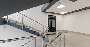 loop rotation and panoramic view in empty modern hall with emergency and evacuation exit stair, columns, doors and panoramic windows.