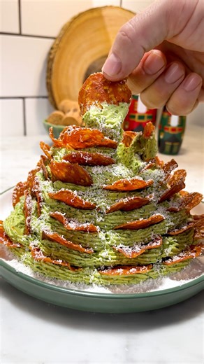 132K views · 77 reactions | @hughwoodward is back at it again with the quick, easy festive recipes. This time creating the unofficial centrepiece of your festive spread. A gloriously green, pesto packed cream cheese cone, studded with crispy pepperoni. It’s exactly what you need!  Link in bio | Twisted | Facebook