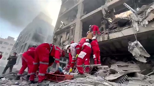 Rescue workers trawl through debris after air strikes hit Tehran's Resalat neighbourhood