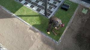 Professional Gardener Laying Roll-Out Turf