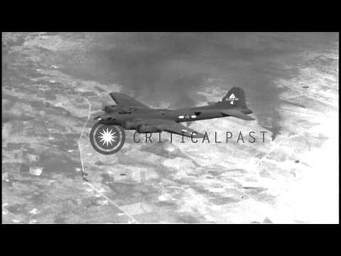 US Army Air Force B-17 bombers drop bombs over Foggia, Italy during World War II. HD Stock Footage