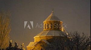 Beautiful Surb Sargis (Saint Sarkis) Armenian apostolic church covered with snow during a winter evening in Nor Nork district in Yerevan, with foreground trees, zoom in, uhd, 4k, 3840, 2160