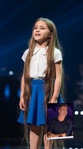 13K views · 157 reactions | She said “It’s a surprise”… and then *blew the roof off*. A shy 13-year-old with a frizzy bob stunned millions with a voice no one saw coming. Gasps. Ovations. Simon? Speechless. 40M views later, it’s still *the* moment. You won’t believe what happens when she hits that first note  | BenjiStreams | Facebook