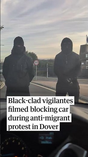 Black-clad vigilantes filmed blocking cars during anti-migrant protest in Dover