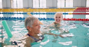 Pool, swimming and senior people, talking and happy for learning in class of fitness. Workout, healthy and exercise of old friends in retirement, cardio and listening to conversation and water