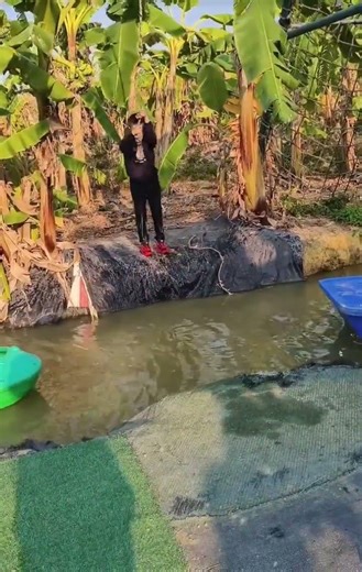 Crossing a Dangerous Rope Bridge Over a Fast-Flowing Canal